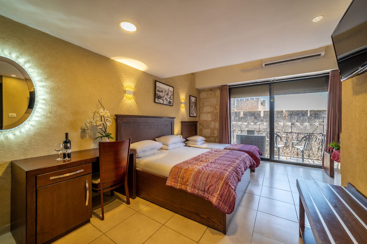Classic Quadruple Room, Multiple Beds, Balcony, City View | In-room safe, desk, iron/ironing board, free WiFi