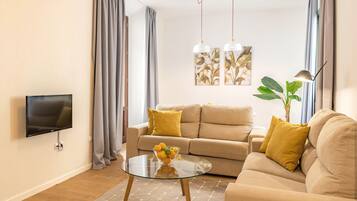 Apartment, 1 Bedroom | Living area | 28-inch plasma TV with cable channels, TV