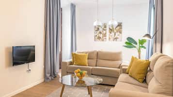 Departamento, 1 habitación | Área de sala de estar | Televisión de plasma de 28 pulgadas con canales por cable y televisión