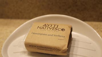 A package of Ayiti Natives® Lemongrass and Verbena on a white plate.
