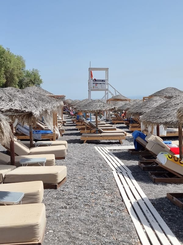 On the beach, black sand, 5 beach bars
