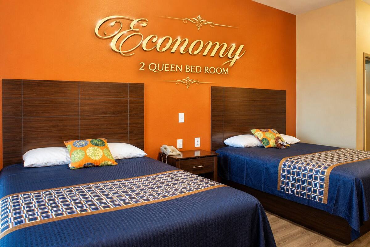 Economy Double Room, 2 Queen Beds, Non Smoking, Refrigerator & Microwave | Premium bedding, Tempur-Pedic beds, desk, laptop workspace