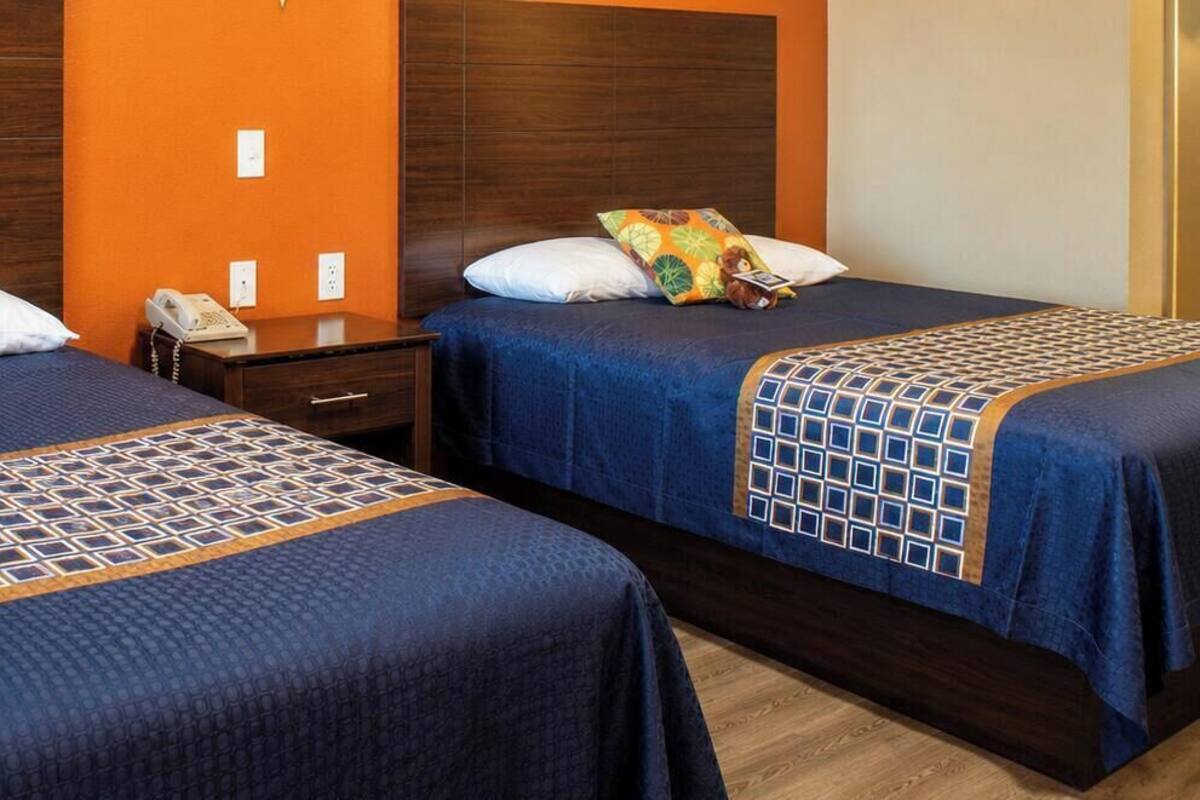 Economy Double Room, 2 Queen Beds, Non Smoking, Refrigerator & Microwave | Premium bedding, Tempur-Pedic beds, desk, laptop workspace