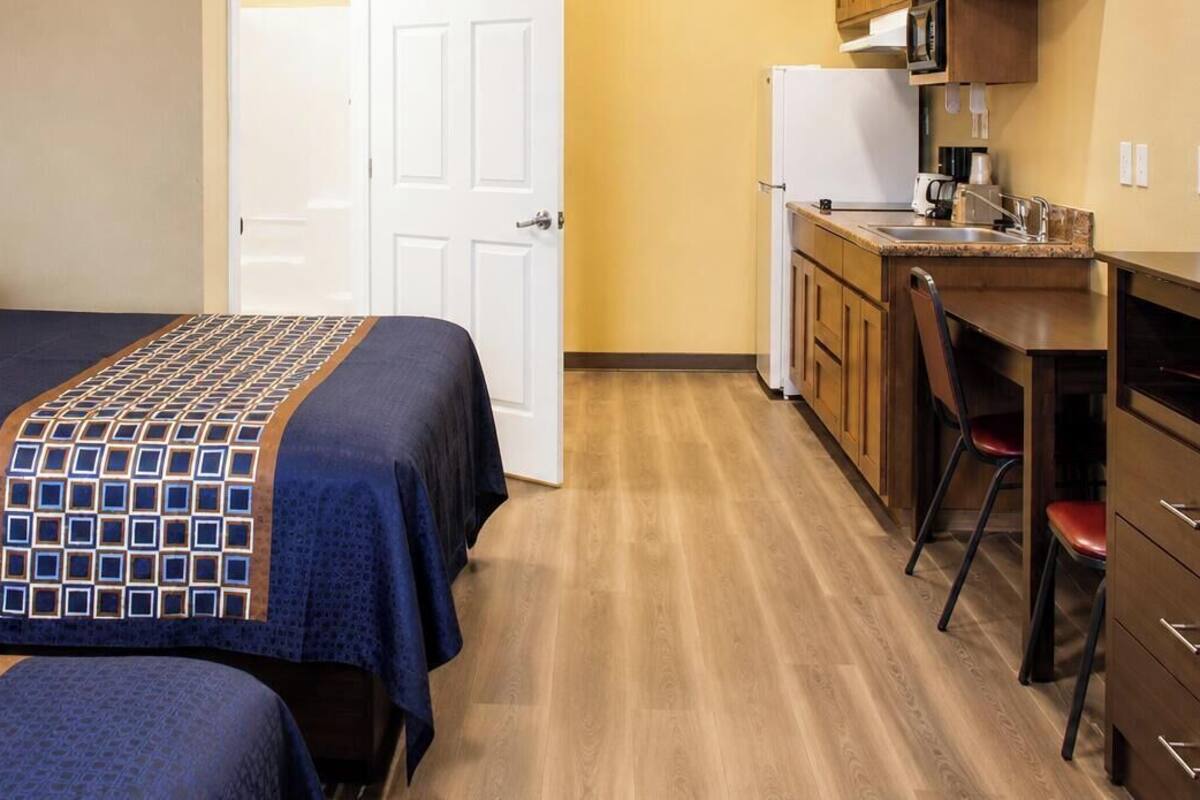 Premium bedding, Tempur-Pedic beds, desk, laptop workspace