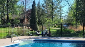 Seasonal outdoor pool, open 9:30 AM to 9:00 PM, pool umbrellas