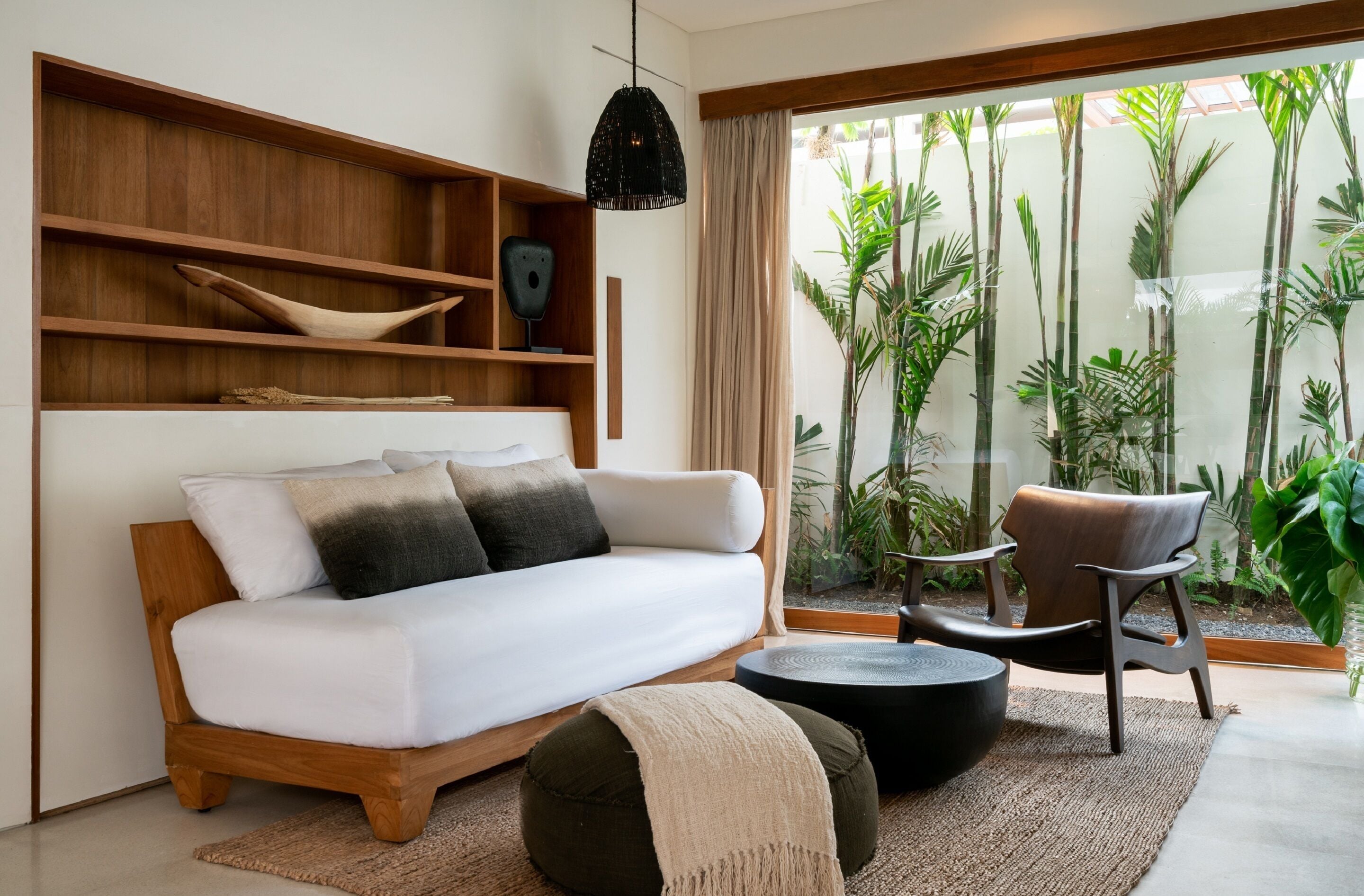 single bedroom pool villa | living room | 55-inch smart tv with cable channels, netflix, books