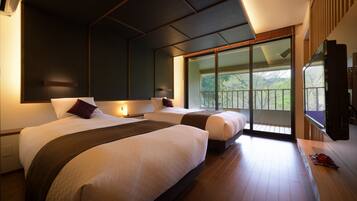 Deluxe Suite, Multiple Bedrooms, Mountain View | Down duvets, in-room safe, blackout curtains, iron/ironing board