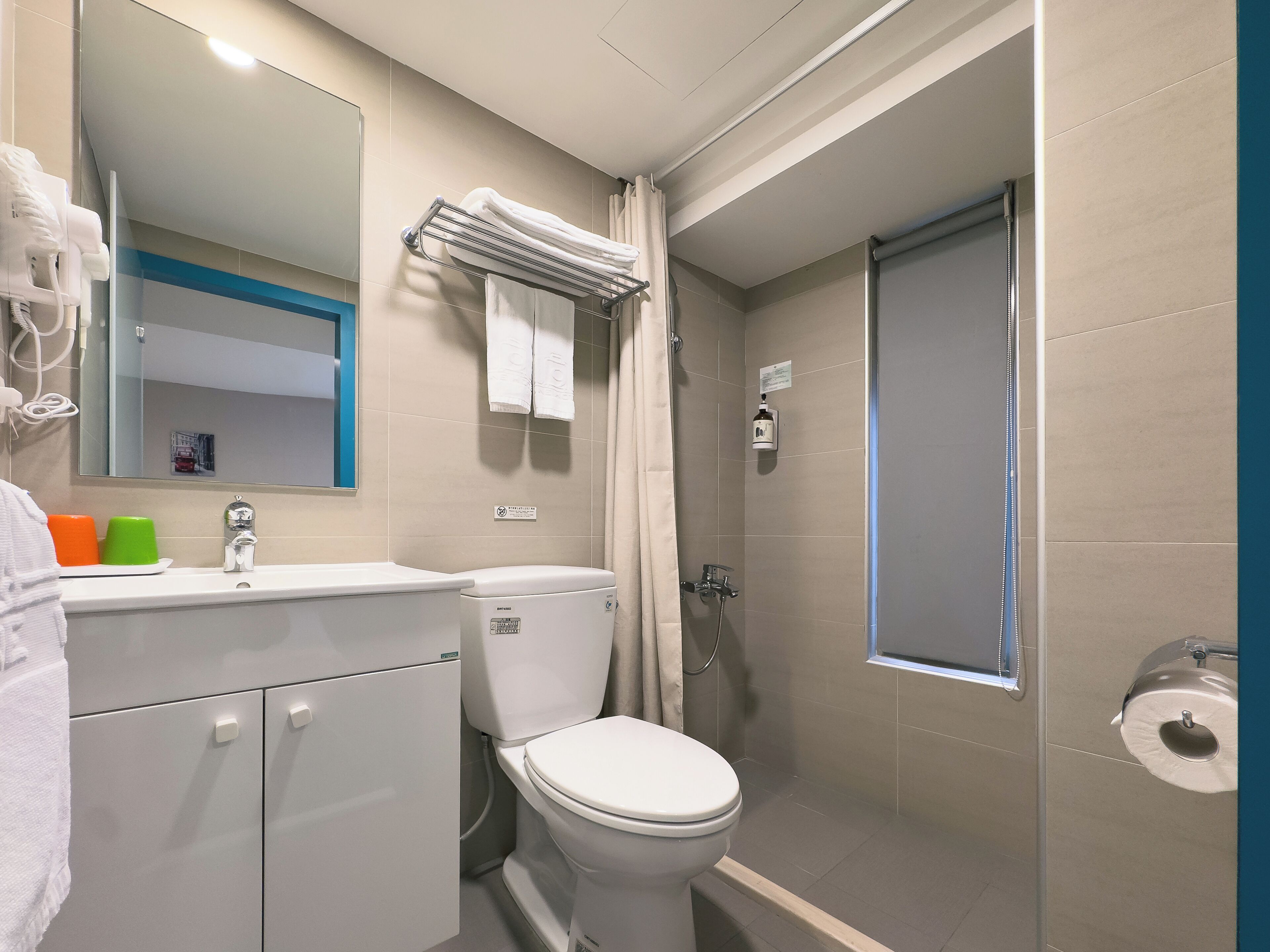 deluxe twin room, 2 single beds | bathroom | shower, rainfall showerhead, hair dryer, towels