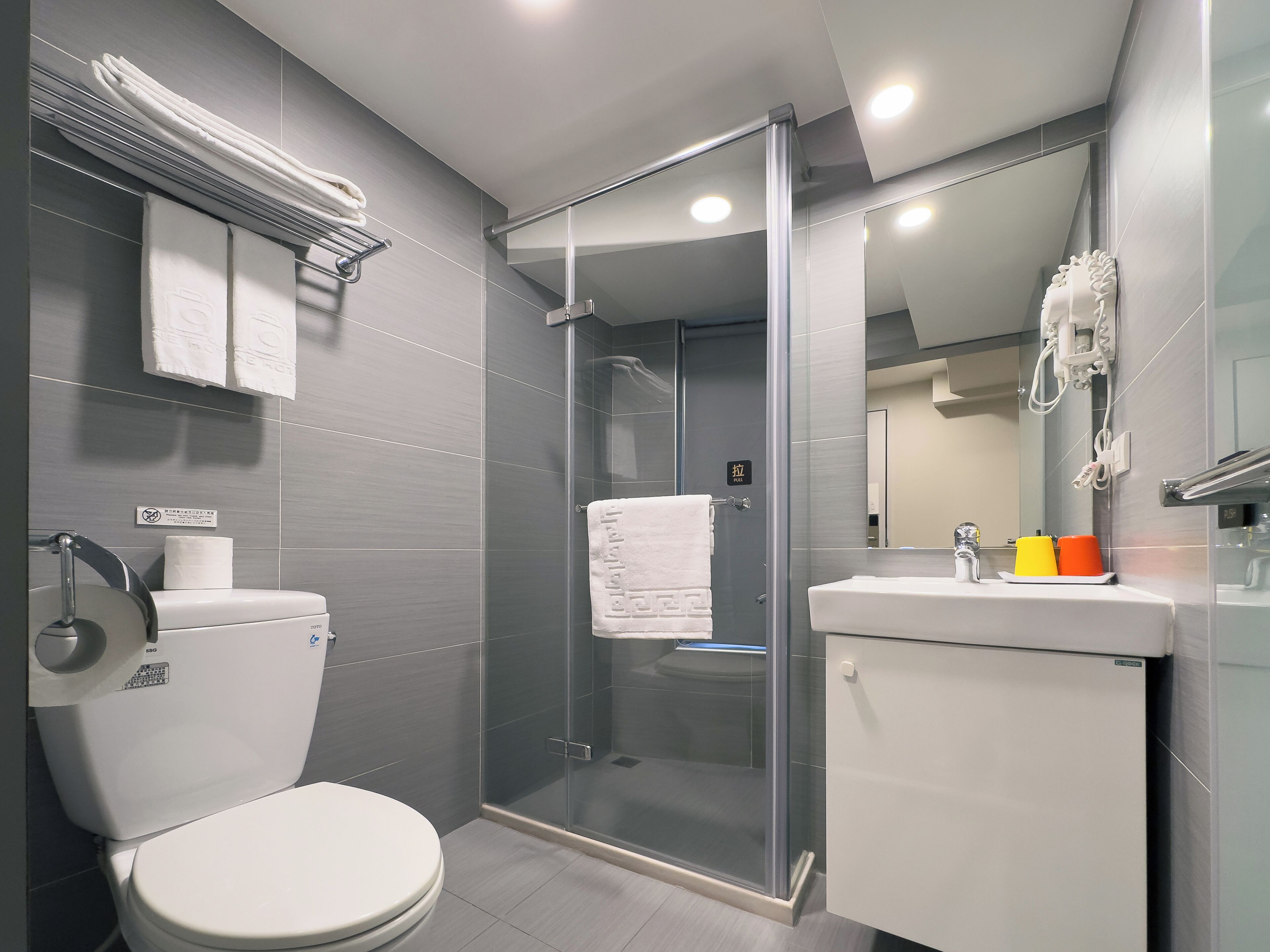 shower, rainfall showerhead, hair dryer, towels