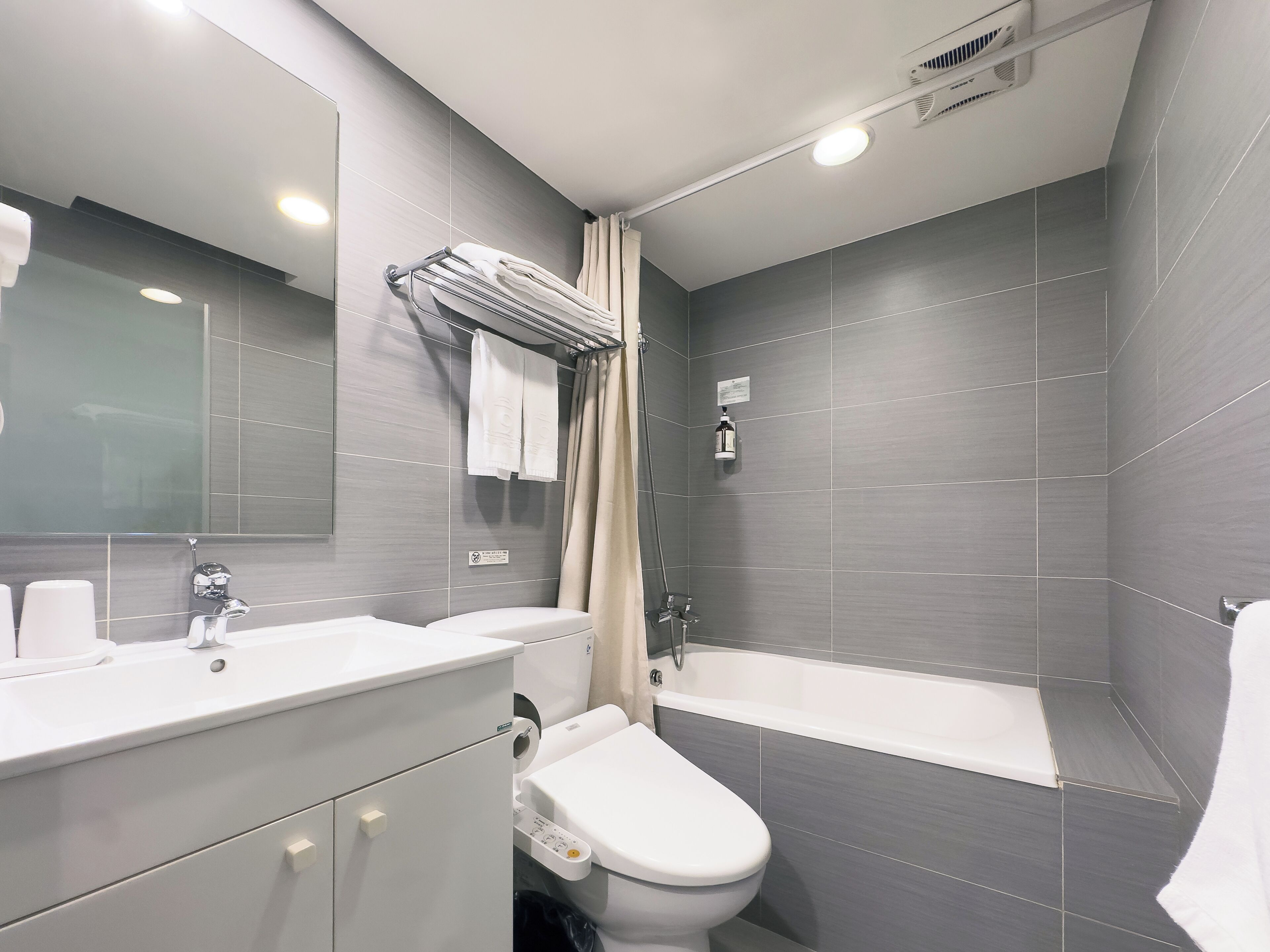 shower, rainfall showerhead, hair dryer, towels