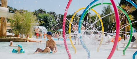 A water park with multiple water slides and a pool area.