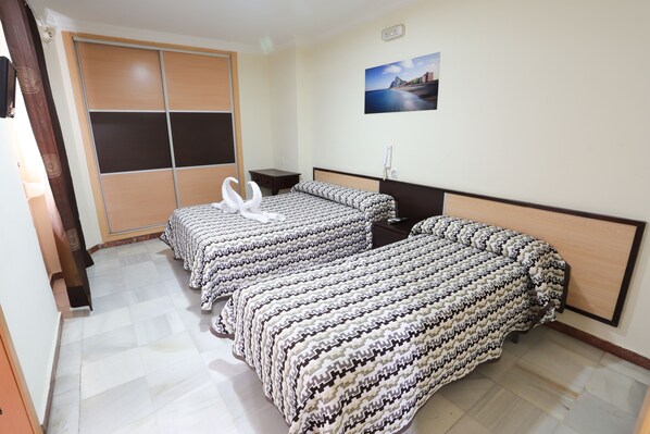 Down duvets, desk, laptop workspace, blackout curtains