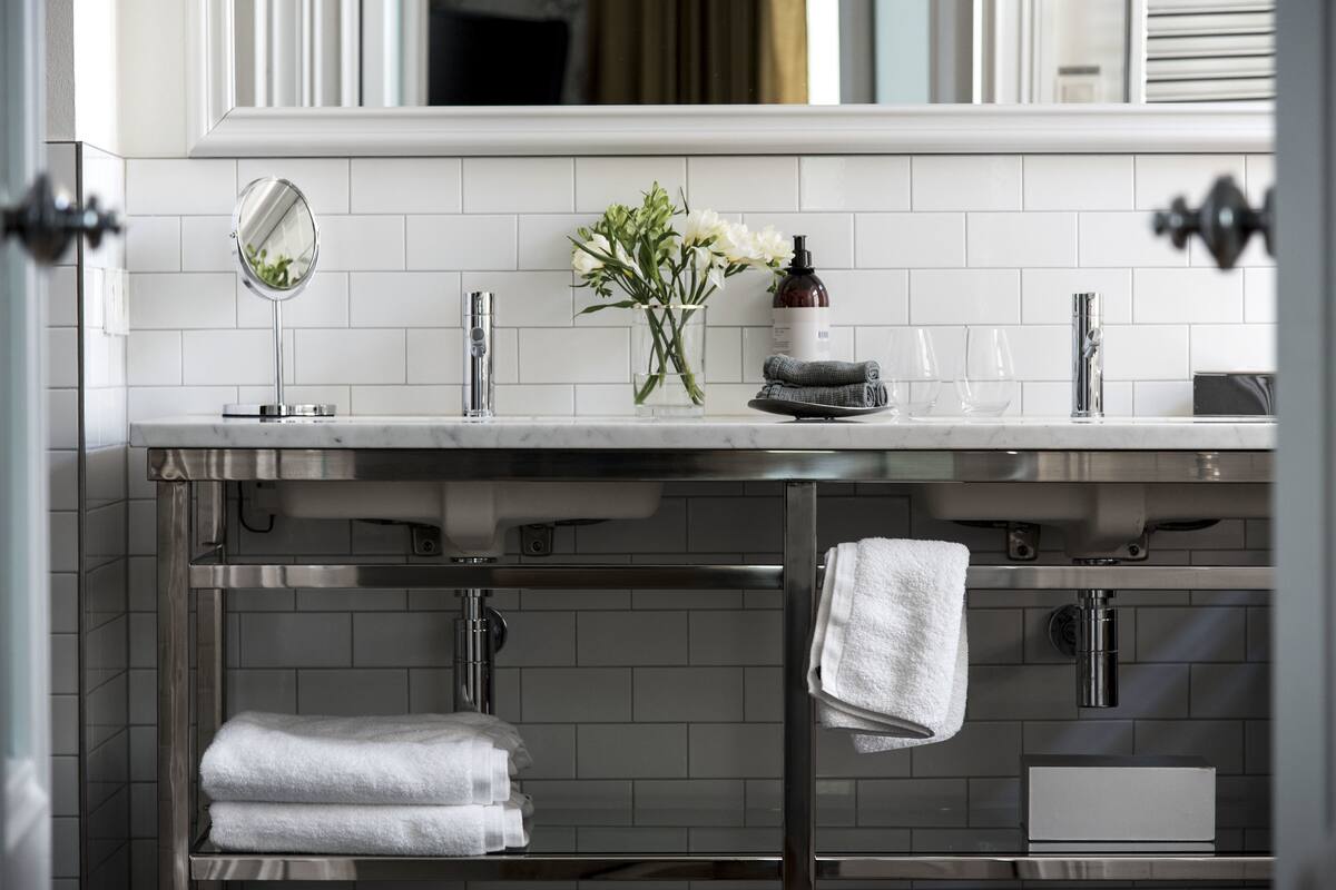 designer toiletries, hair dryer, bathrobes, heated floors