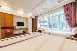 Deluxe Triple Room | Living area | 32-inch TV with cable channels - Home Hotel Hanoi (Hanoi)