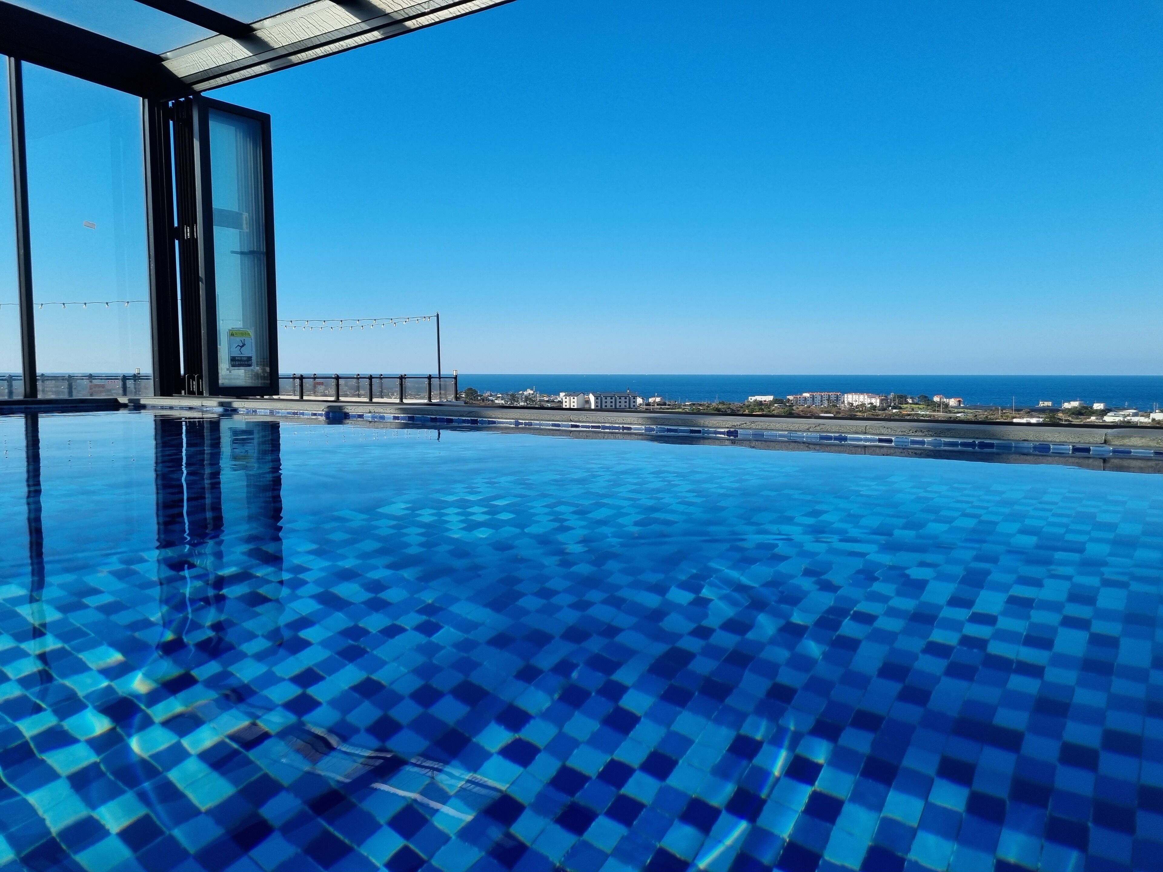 indoor pool, seasonal outdoor pool, pool umbrellas, pool loungers