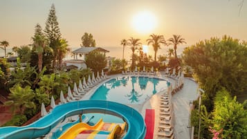 Indoor pool, seasonal outdoor pool, pool umbrellas, pool loungers