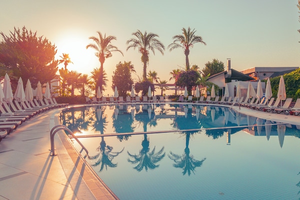 Indoor pool, seasonal outdoor pool, pool umbrellas, sun loungers