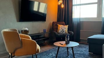 Suite, sauna | Een minibar, een kluis op de kamer, een strijkplank/strijkijzer