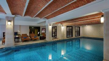 Indoor pool, pool umbrellas, sun loungers