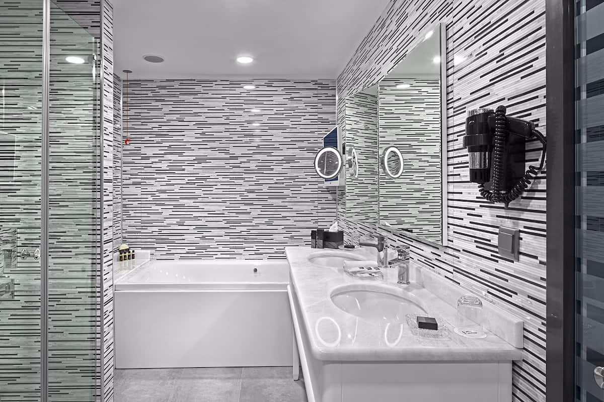 eco-friendly toiletries, hair dryer, slippers, towels