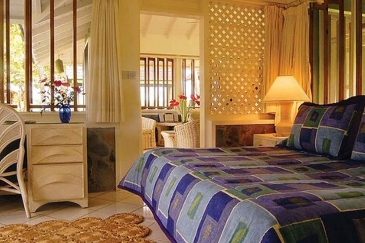 superior cottage, patio, sea view | in-room safe, desk, iron/ironing board, cots/infant beds