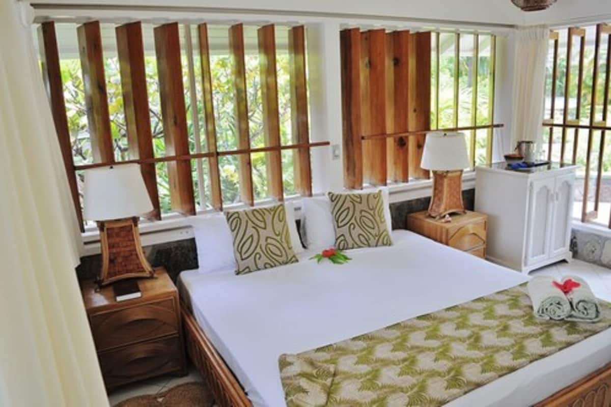 superior cottage, patio, sea view | in-room safe, desk, iron/ironing board, cots/infant beds