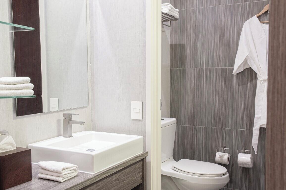 designer toiletries, hair dryer, towels, soap