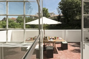 Apartment, 1 Bedroom, Kitchenette, City View | Living area | Flat-screen TV, DVD player, iPod dock