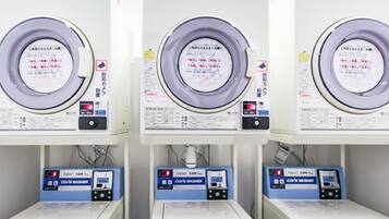Three rows of identical machines with labels in a foreign language, likely indicating a specialized facility or equipment.