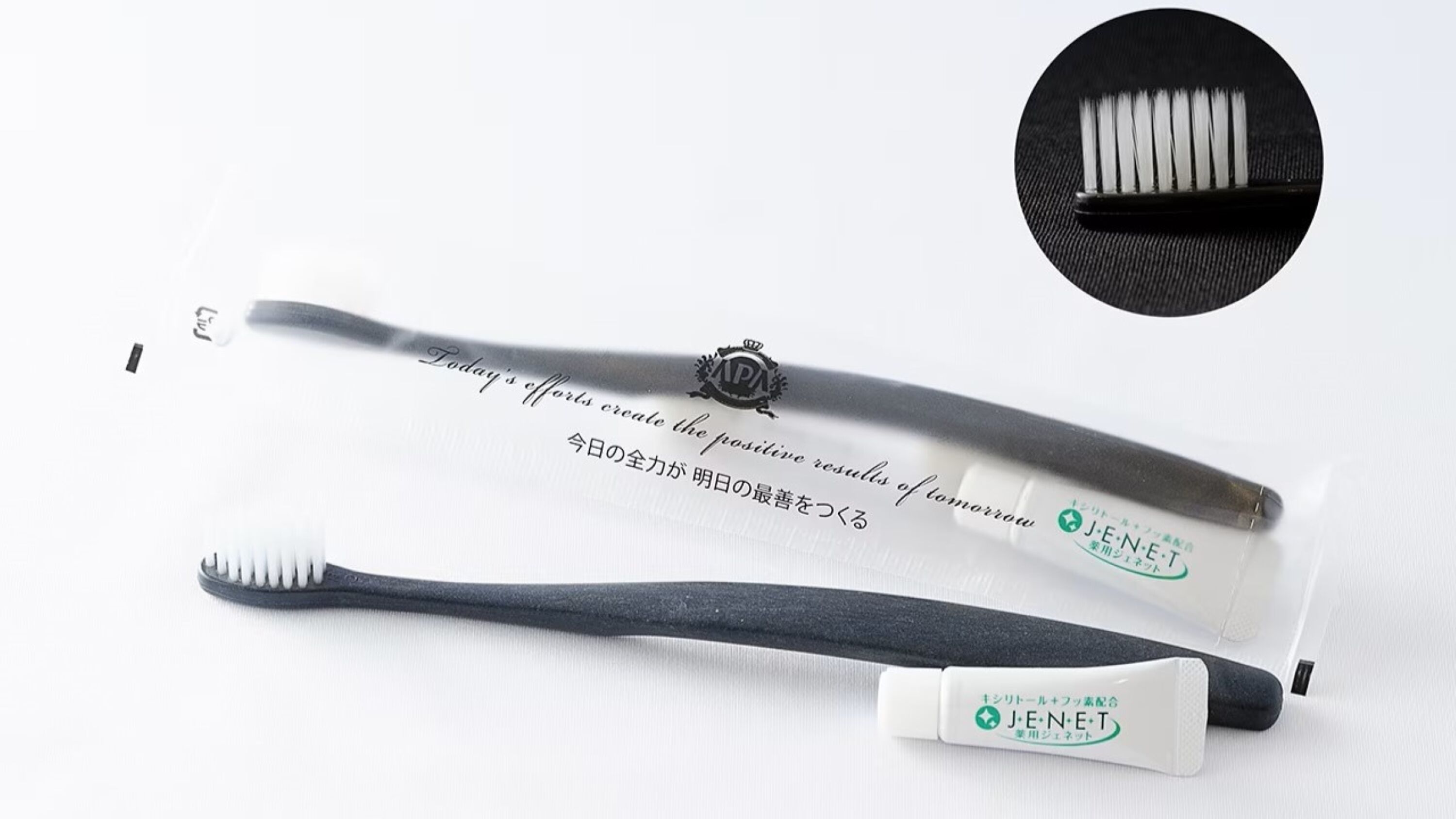 A toothbrush with a handle and bristles, and a toothbrush head with a handle.