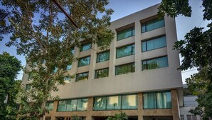 A multi-story building with large windows and a flat facade.