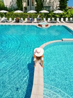 Seasonal outdoor pool, open 9:00 AM to 7:00 PM, pool umbrellas