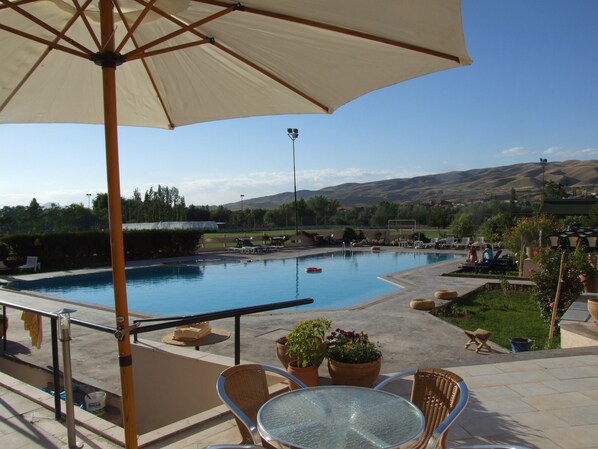 Indoor pool, outdoor pool, pool umbrellas, pool loungers