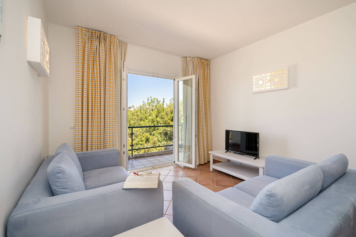 superior apartment, 1 bedroom | living area | tv