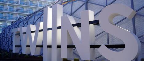 A modern building with large 'EWINS' letters and a glass facade.