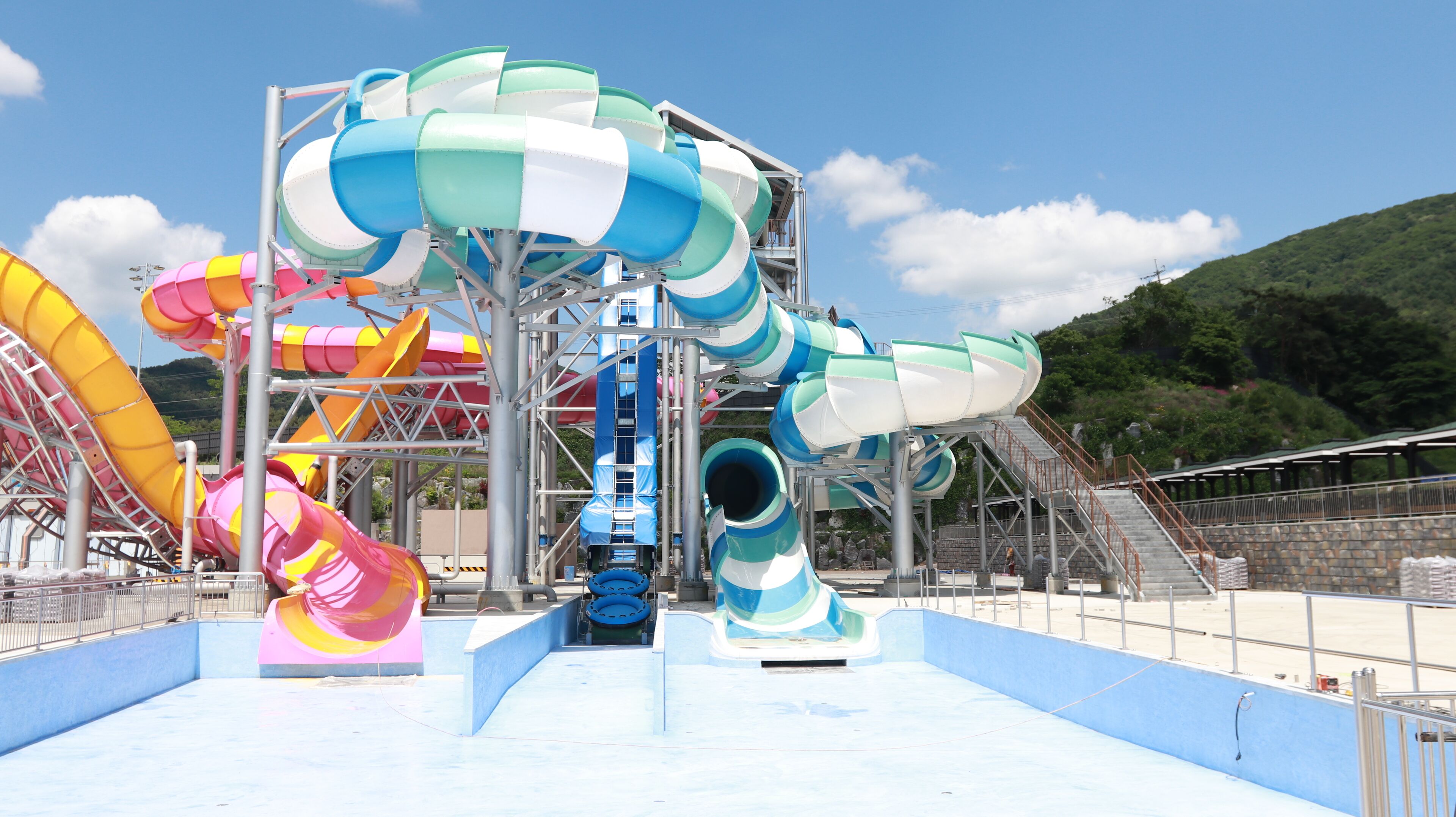 A water park with multiple slides and a pool area.