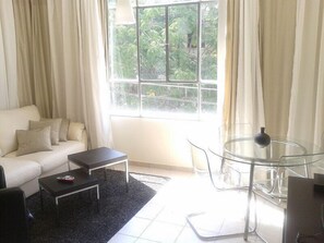 Superior Apartment, 1 Bedroom | Living room | Flat-screen TV, first-run films - Dato's Apartments (Tel Aviv)