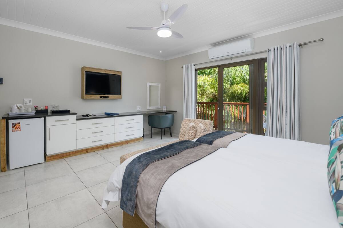 twin room with patio | in-room safe, free wifi, bed sheets