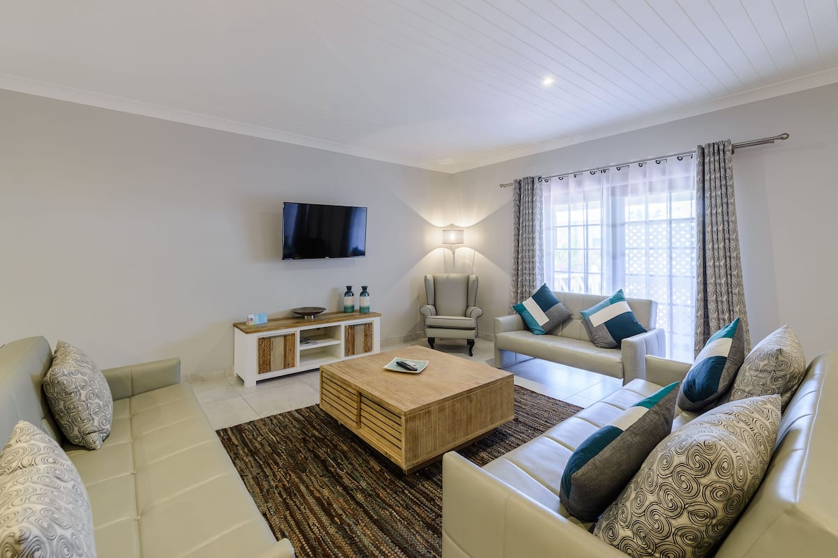 one bedroom apartment with patio | living area | tv