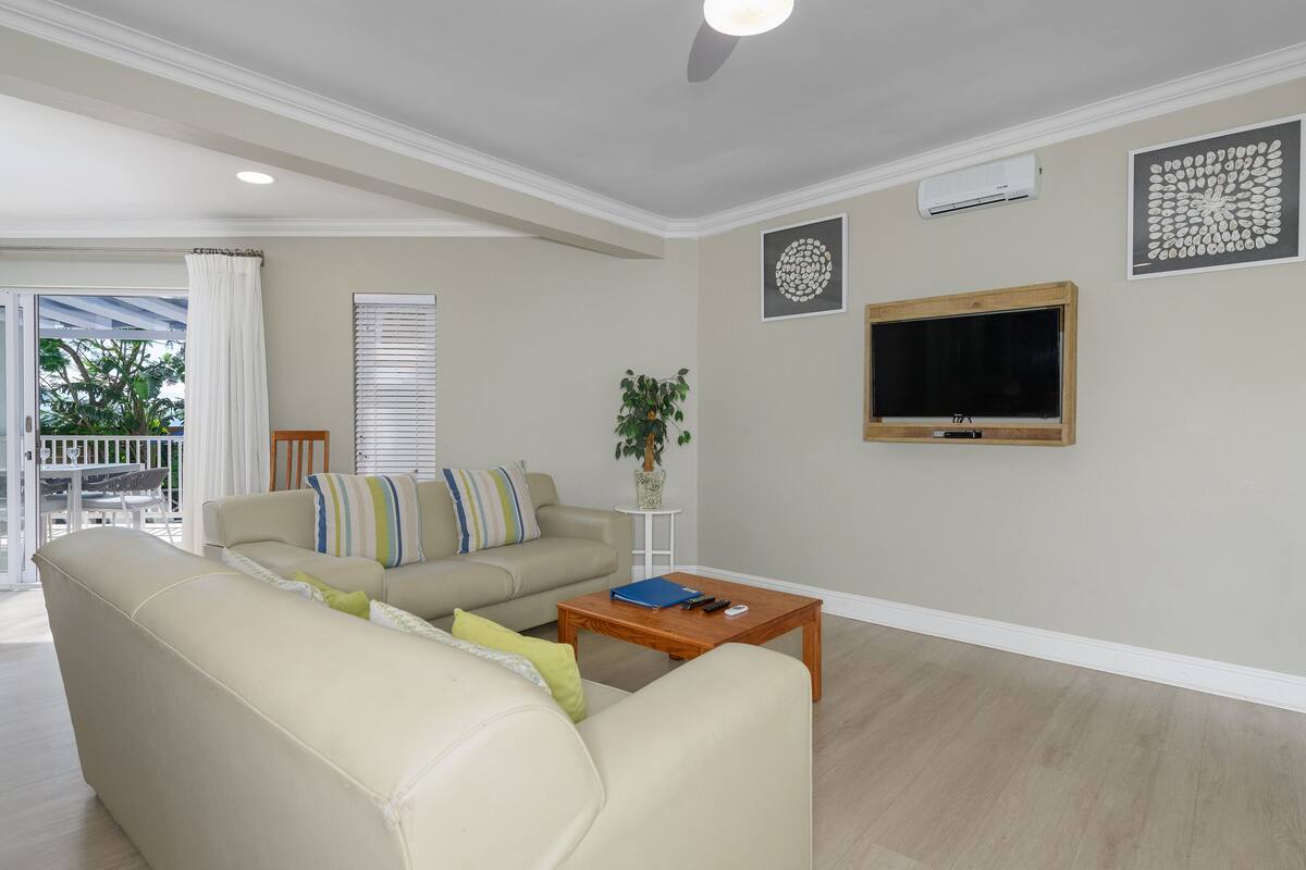 two bedroom apartment with patio | living area | tv