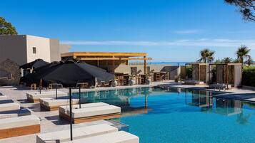 Seasonal outdoor pool, pool umbrellas, pool loungers