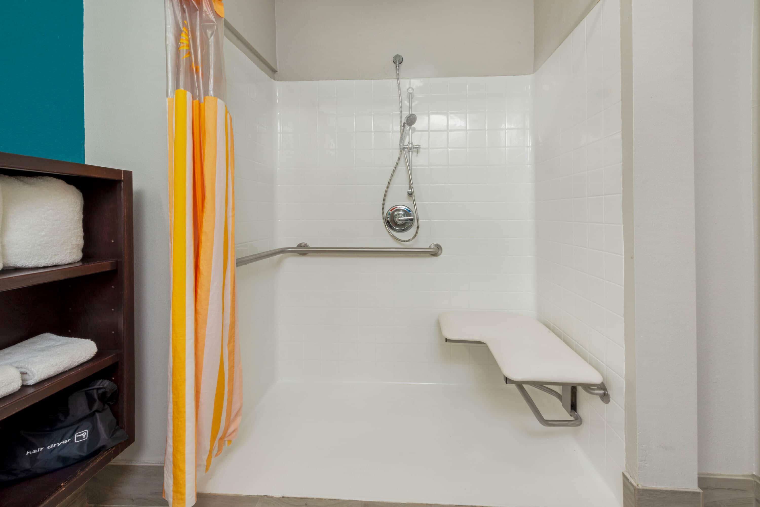 executive room, 1 king bed, accessible, non smoking (mobility/hearing, roll-in-shower) | bathroom | combined shower/bathtub, free toiletries, hair dryer, towels