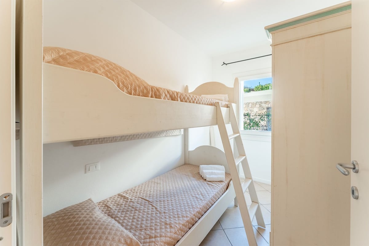 Apartment, 2 Bedrooms | Iron/ironing board, cribs/infant beds, bed sheets
