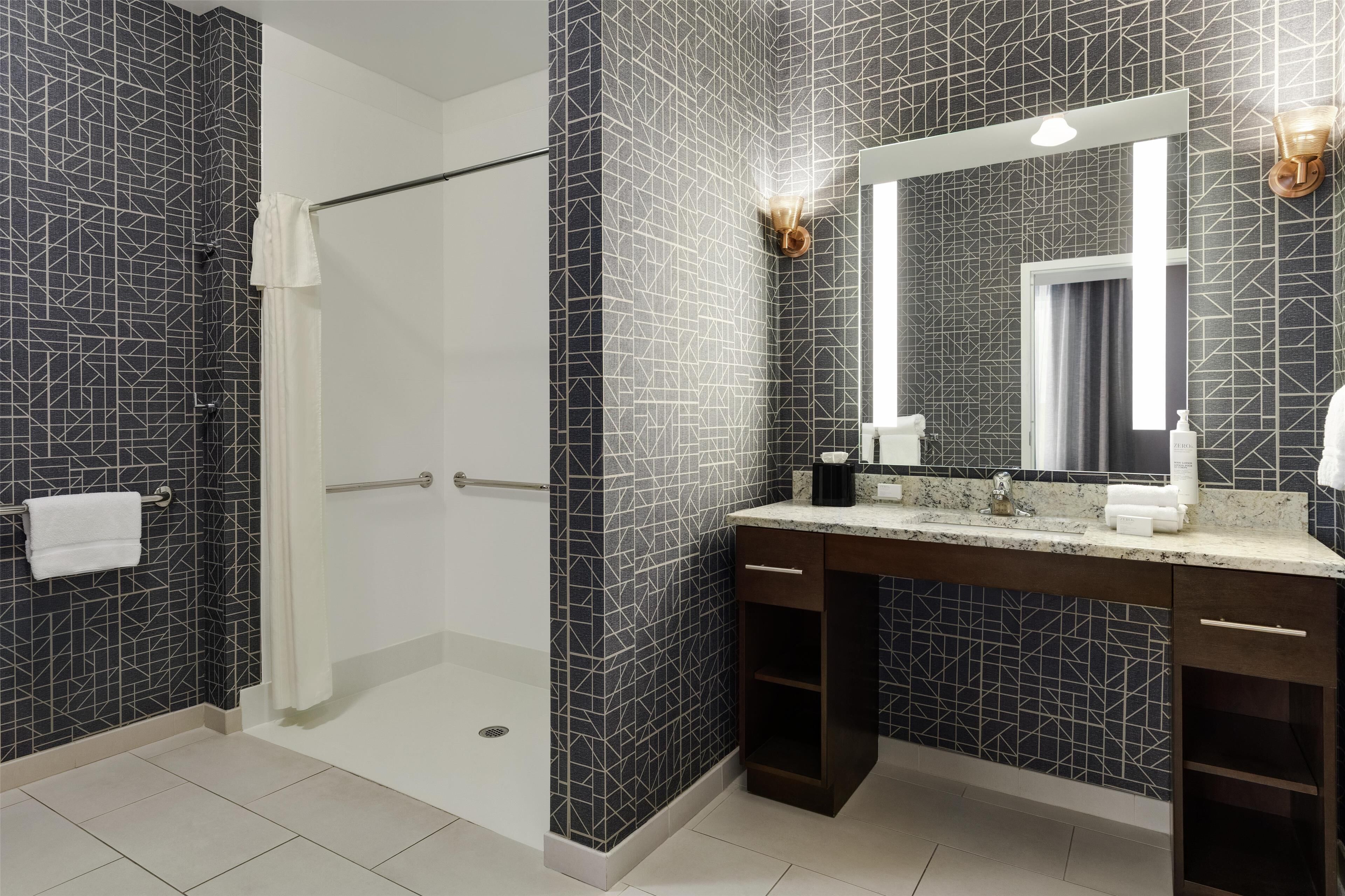 studio, 1 king bed, accessible (roll-in shower) | bathroom | free toiletries, hair dryer, towels