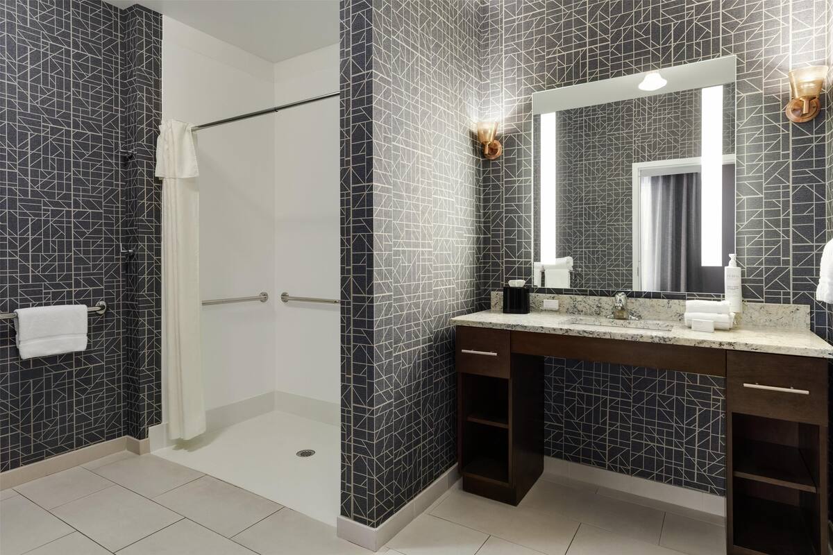 studio, 1 king bed, accessible (roll-in shower) | bathroom | free toiletries, hair dryer, towels