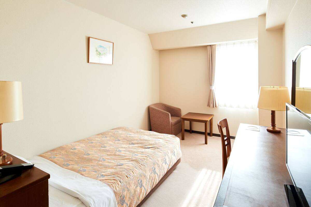 Desk, blackout curtains, iron/ironing board (on request), free WiFi