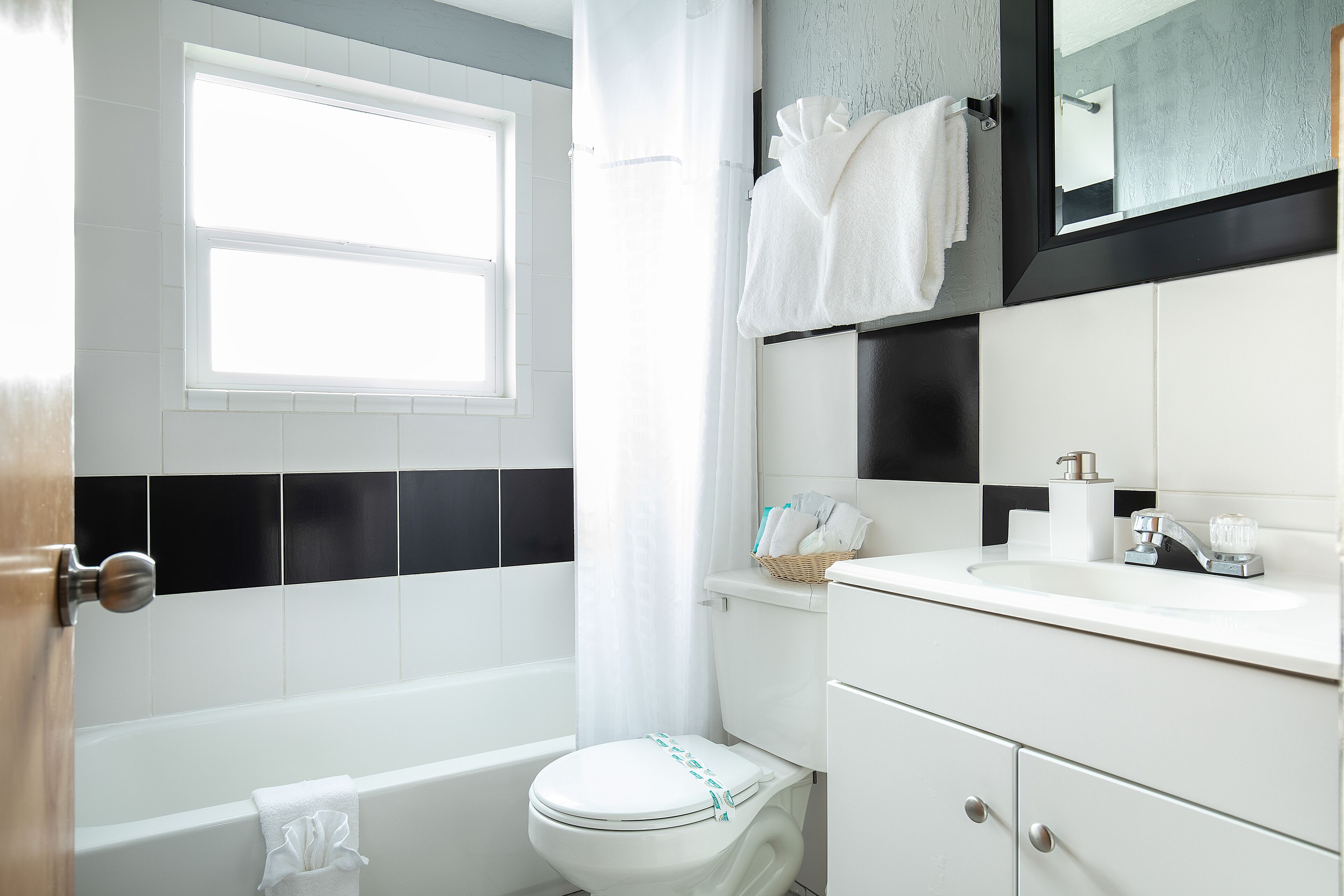 1-bedroom suite with 3 queen beds, refrigerator & microwave | bathroom | combined shower/bathtub, free toiletries, hair dryer, towels