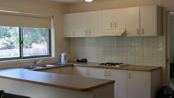 Two Bedroom Apartment | Private kitchen | Full-size fridge, microwave, oven, stovetop