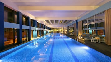 Indoor pool, open 8:00 AM to 7:00 PM, pool loungers