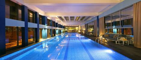 Indoor pool, open 8:00 AM to 7:00 PM, pool loungers, lifeguards on site